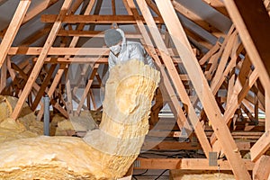 insulation of the house under the roof with the help of glass wool