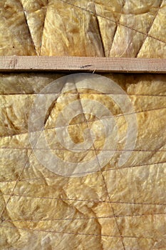 Insulation material rock-wool on wall background