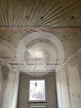 Insulation panels made of mineral wool, which were glued to the ceiling.