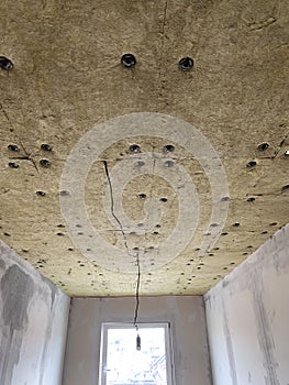 Insulation panels made of mineral wool, which were glued to the ceiling.