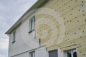 Insulation of a residential building. Exterior repair work on the building, insulation and cladding of the facade of the