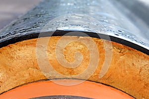 Insulation. Steel Pipe with Heat Insulation closeup.