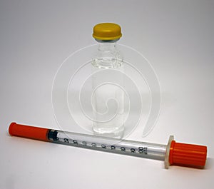 Insulin medicine bottle and syringe on white background. Type 1 diabetes. Close-up with space for inscription