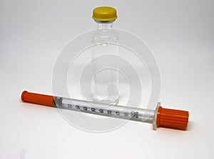 Insulin medicine bottle and syringe on white background. Type 1 diabetes. Close-up with space for inscription