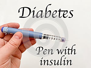 Insulin syringe-pen in hand on a white isolated background. Insulin for diabetics