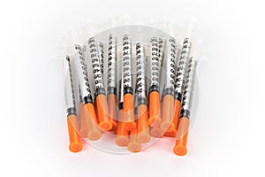 Insulin syringes on white background