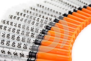 Insulin syringes on white background