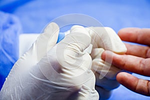 Insulin testing process, blood test and syringe. Injection in the hand. Patients and doctor