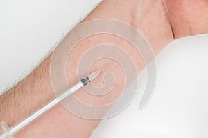 Insuline injector on the arm photo
