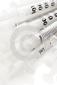 Insulinic syringes on a white background