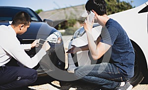 Insurance agents inspect for damage to cars that collide on the road to claim compensation from driving accidents