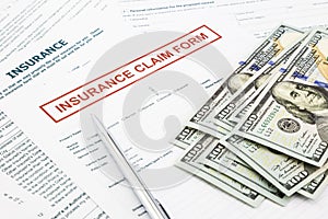 Insurance claim form and money photo