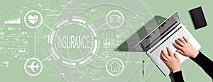 Insurance concept with person using laptop computer