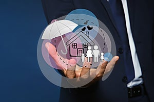 Insurance concept - umbrella demonstrating protection. Man with illustrations on background, closeup