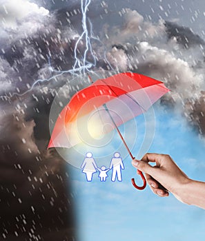 Insurance concept. Woman covering family illustration with red umbrella during storm, closeup