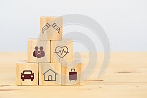 Insurance concept, wooden cube symbolize put the insurance to protect or cover person, Property ,Liability, reliability,car, life,