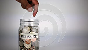 Insurance glass jar money saving concept