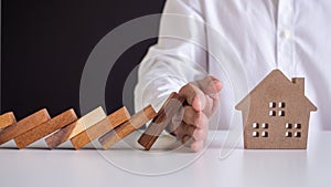 Insurance with hands protect a house. Home insurance or house insurance concept