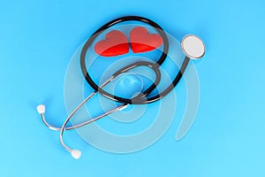 Insurance Health concept - Stethoscope and red heart healthcare on blue background