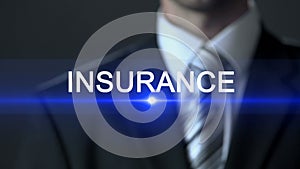 Insurance, male in official suit pressing button on screen, security, protection