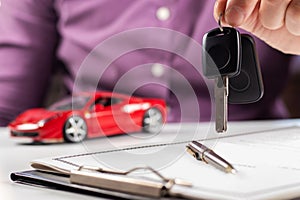 Insurance officers hand over the car keys after the tenant