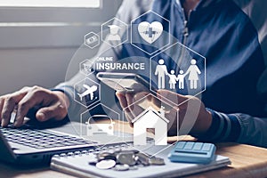 Insurance online insurtech business finance technology concept. Businessman using smartphone and computer to insurance online