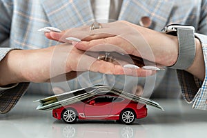 Insurance or protect car with dollar money and hand of vechicle