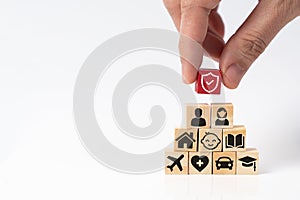 Insurance service concept with shield protection icon on top of various types of insurance icons