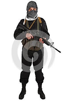 Insurgent dressed in black uniform and black and white shemagh with m4 assault rifle photo