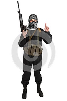 Insurgent dressed in black uniform and black and white shemagh with m4 assault rifle