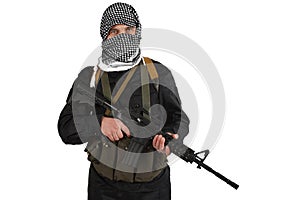 Insurgent dressed in black uniform and black and white shemagh with m4 assault rifle