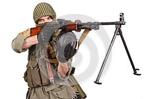 Insurgent wearing keffiyeh with machine gun