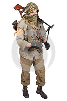 Insurgent wearing keffiyeh with machine gun