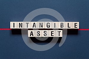 Intangible asset word concept on cubes