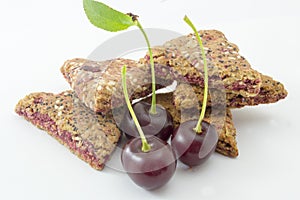 Integral biscuits with fresh cherry fruit on white