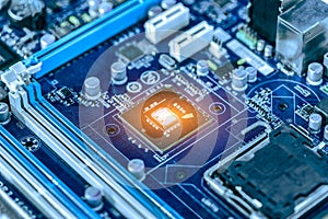 Integrated semiconductor microchip microprocessor on blue circuit board representative of the high tech industry and computer