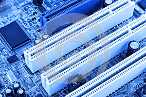 Integrated semiconductor microchip microprocessor on blue circuit board representative of the high tech industry and computer scie