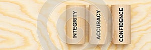 Integrity, accuray and confidence printed on three pillars