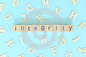 Integrity core values concept in business, company and organization. Word typography on wooden blocks