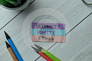Integrity, Honest, Ethics write on sticky notes isolated on office desk