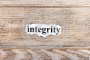 Integrity text on paper. Word Integrity on torn paper. Concept Image