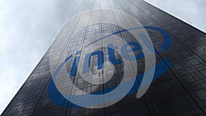 Intel Corporation logo on a skyscraper facade reflecting clouds. Editorial 3D rendering