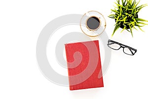 Intellectual entertainment concept. Books with empty cover near glasses, coffe, plant on white desk top view space for
