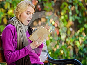 Intellectual hobby. Girl sit bench relaxing with book fall nature background. Lady bookworm read book outdoors fall day
