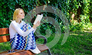 Intellectual hobby. Lady pretty bookworm busy read book outdoors sunny day. Woman concentrated reading book in garden