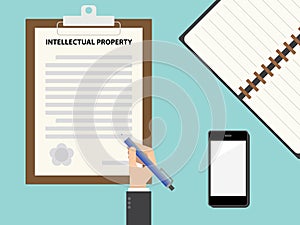 Top view of Intellectual property contract clipboard