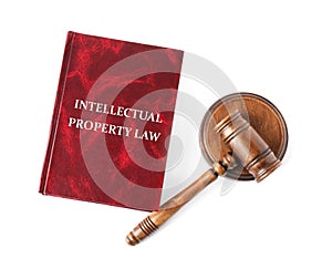 Intellectual Property law book and judge`s gavel on white background