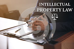 Intellectual property law. Jurist at table in office photo