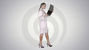 Intellectual woman healthcare personnel with white labcoat, look