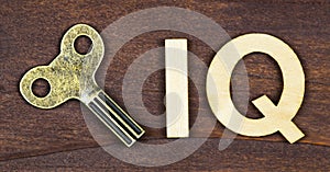 Intelligence quotient, iq test concept, key with letters on a wooden background, banner photo
